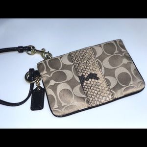 Coach tan wristlet with snakeskin strip
